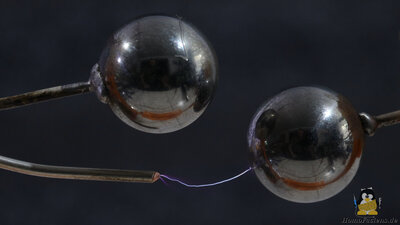 Steel balls and wire tip in high voltage