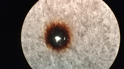 Print dot through a microscope